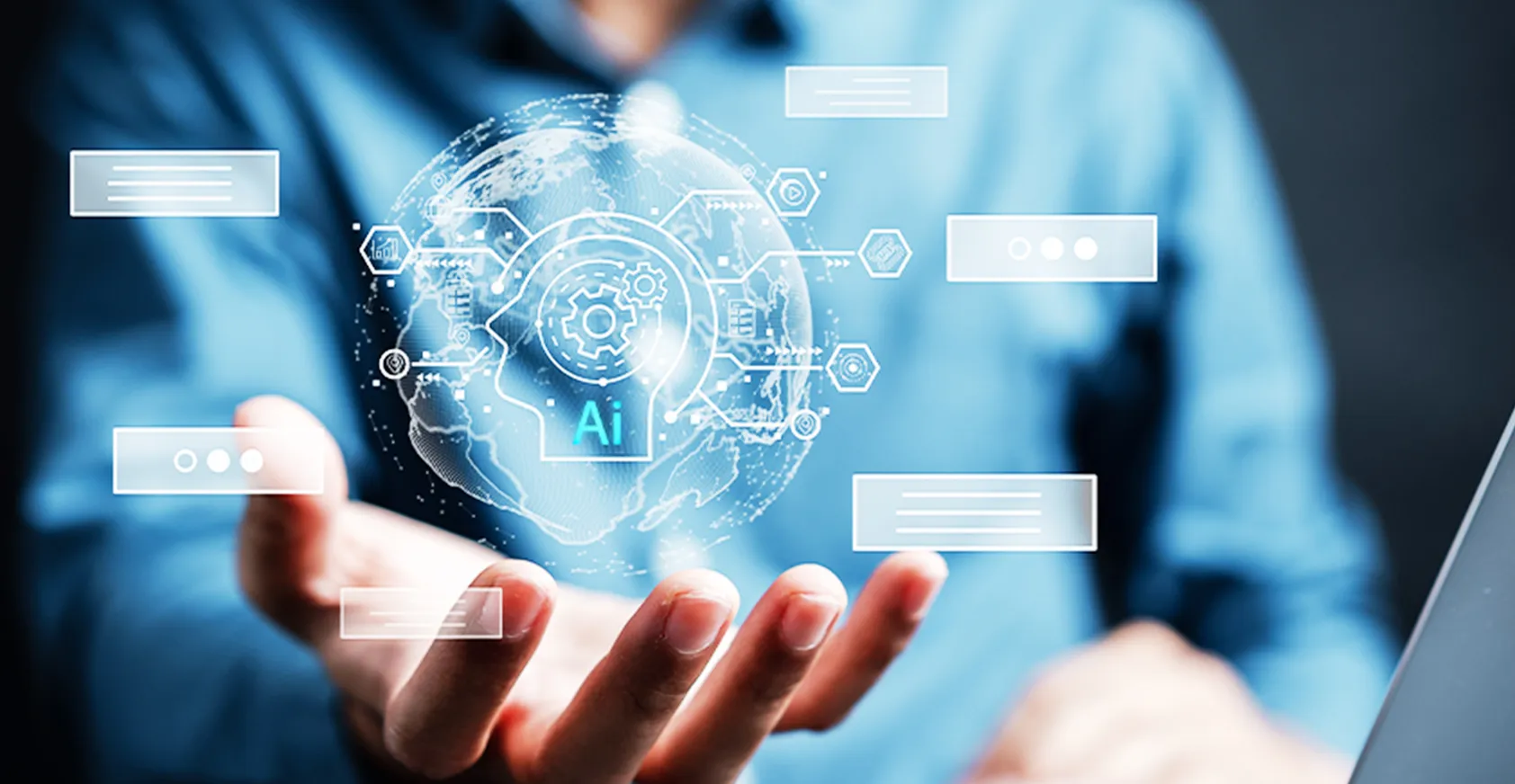 シャツを着た男性が手からAIのホログラムを出している画像