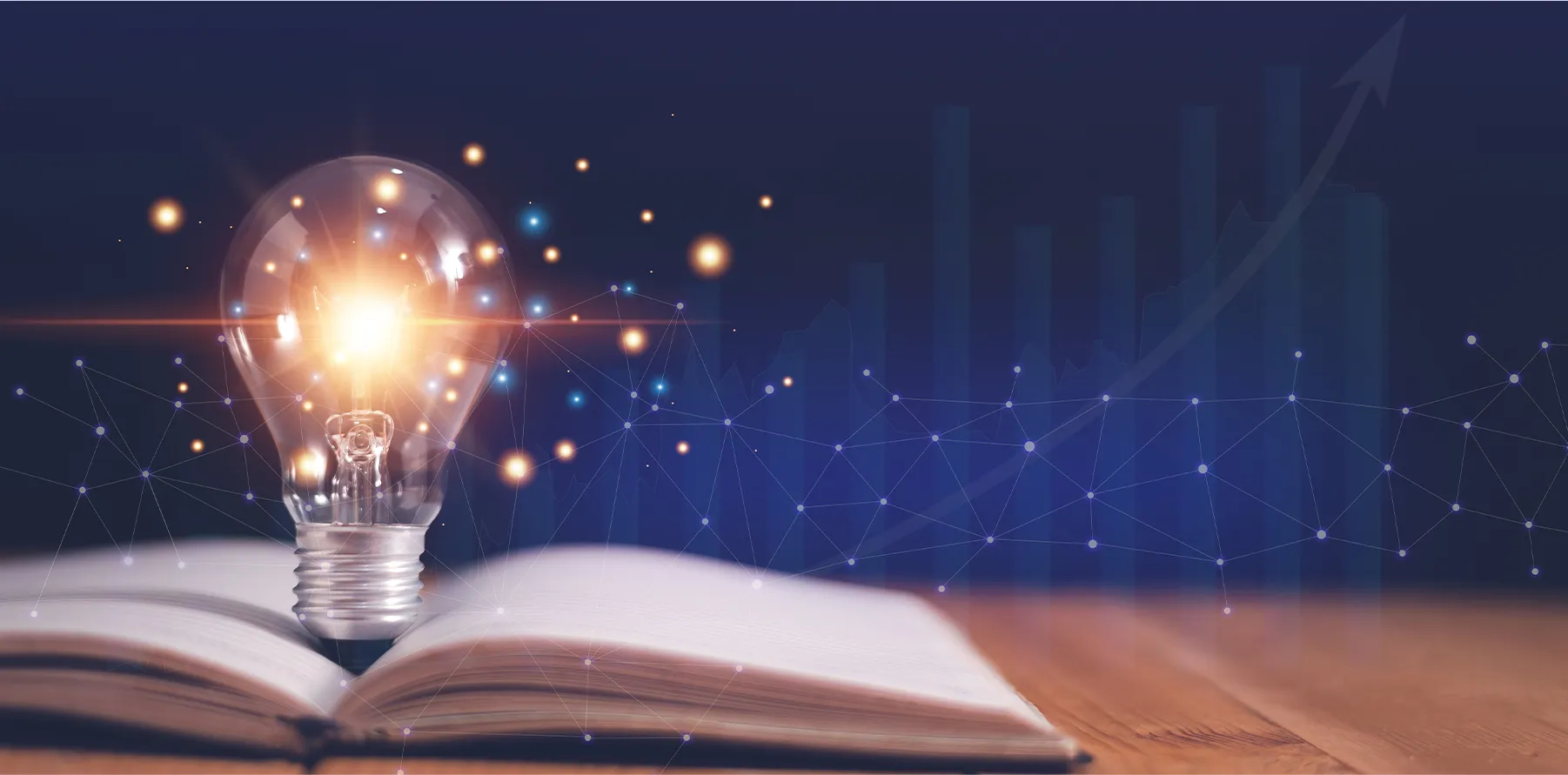 本から電球が飛び出し、ひらめていることを想像させる画像